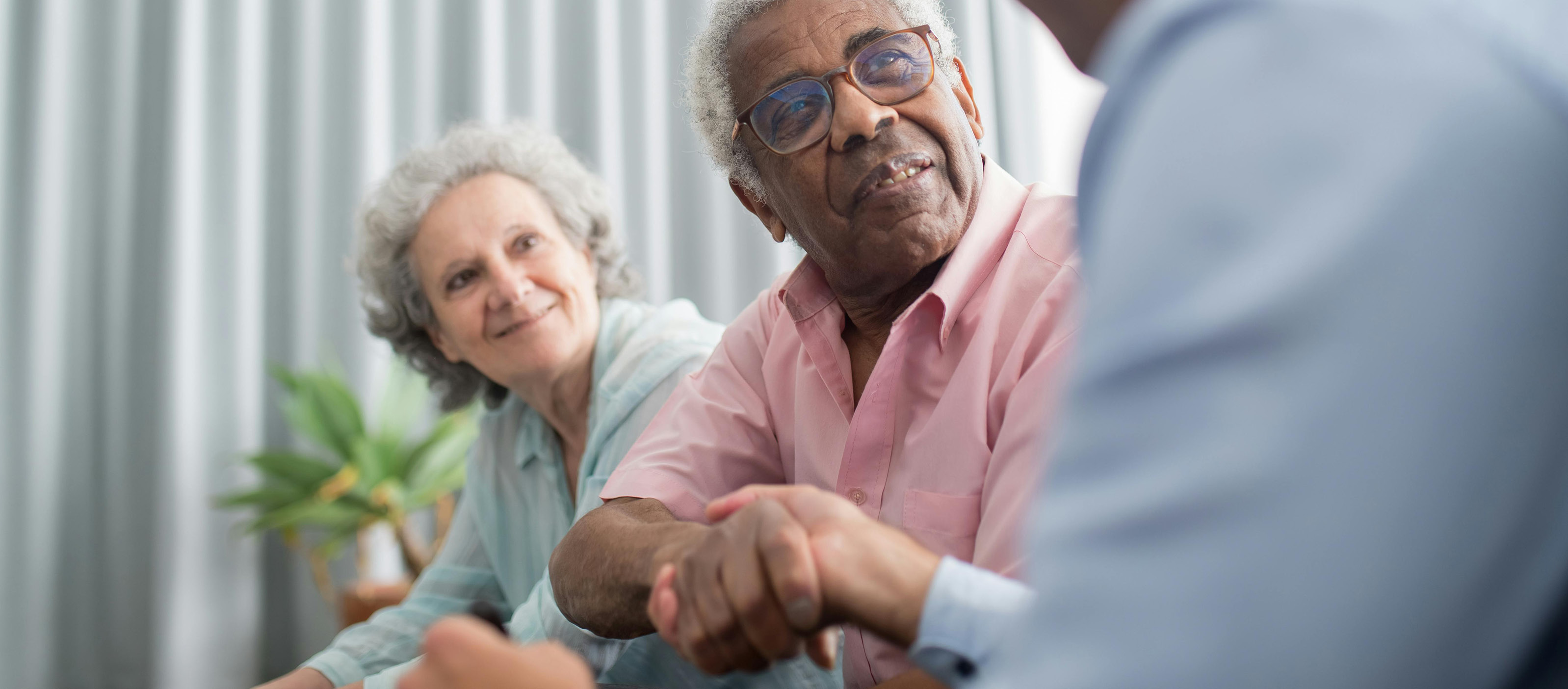 Older couple meets with consultant