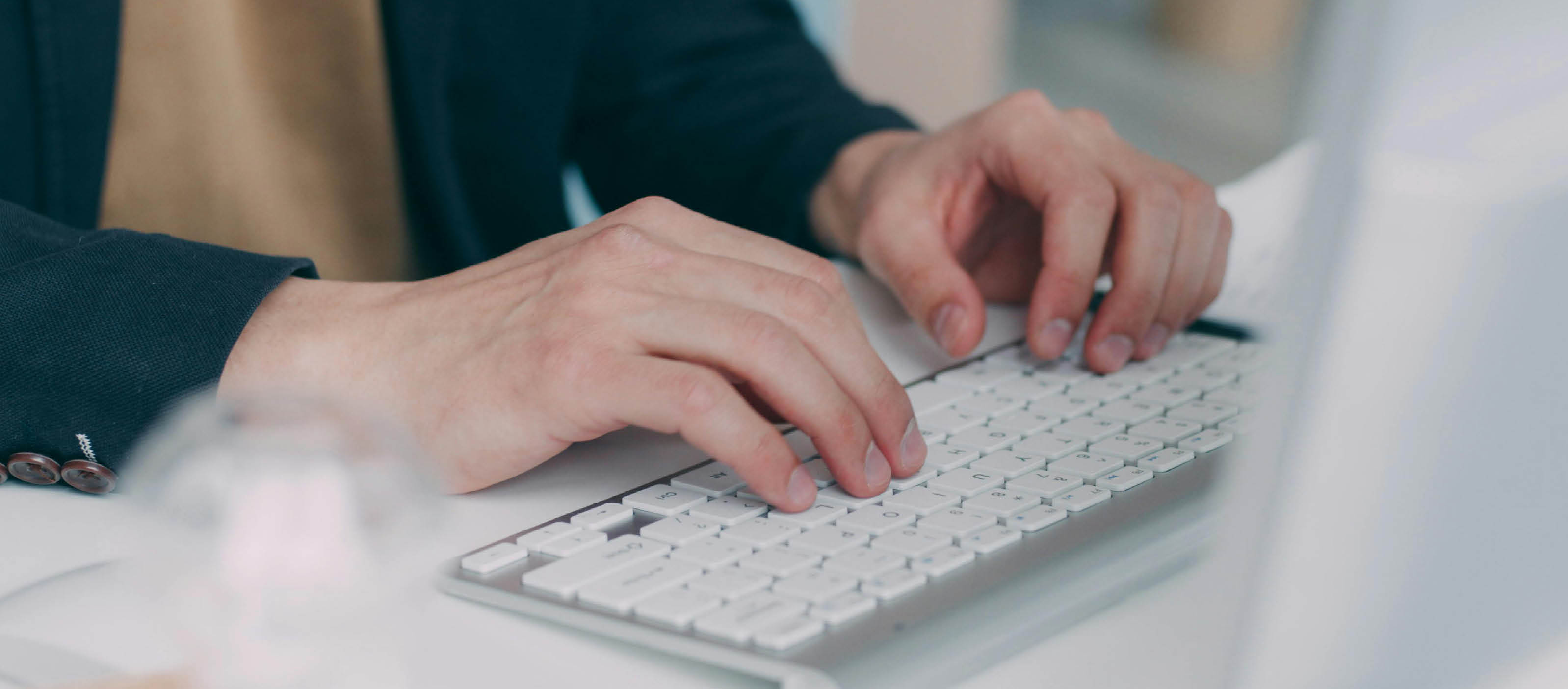 Image of person typing on a keyboard